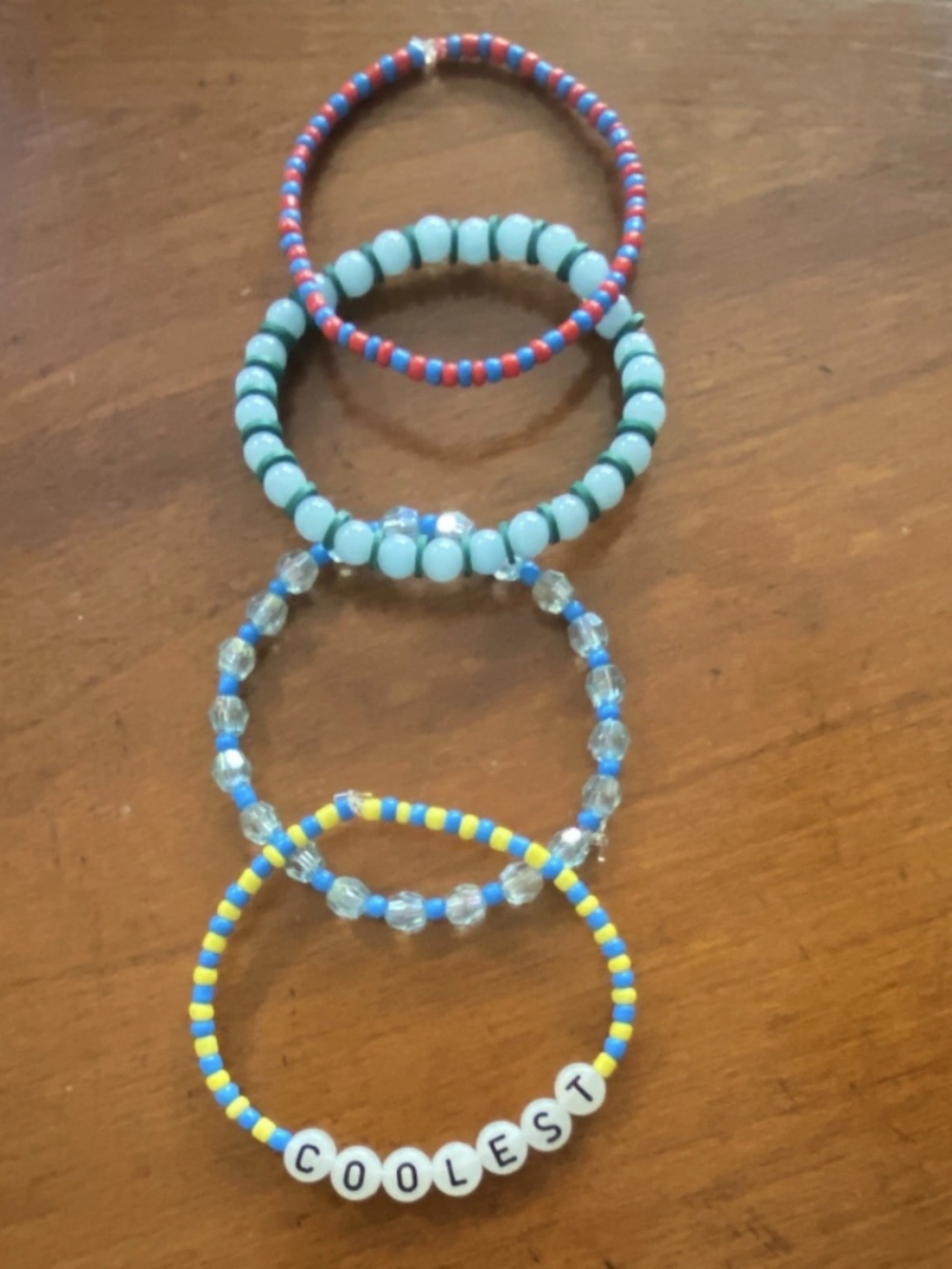 Lot of 4 Stackable Beaded Stretch Bracelets Plastic Round, COOLEST Letter